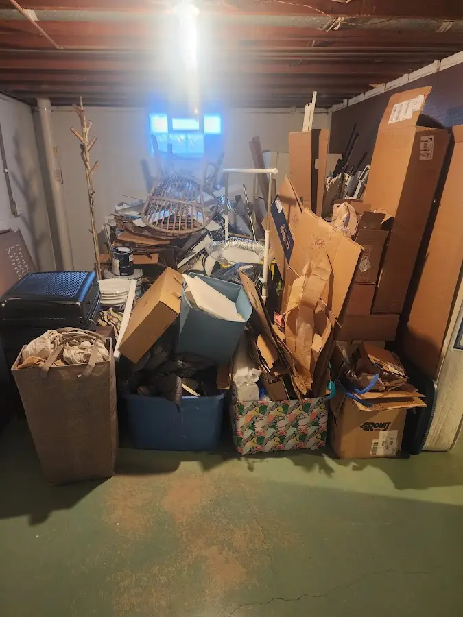 Roll-off dumpster container at job site for 2 Yard Dumpster Rental in Beaver Dam